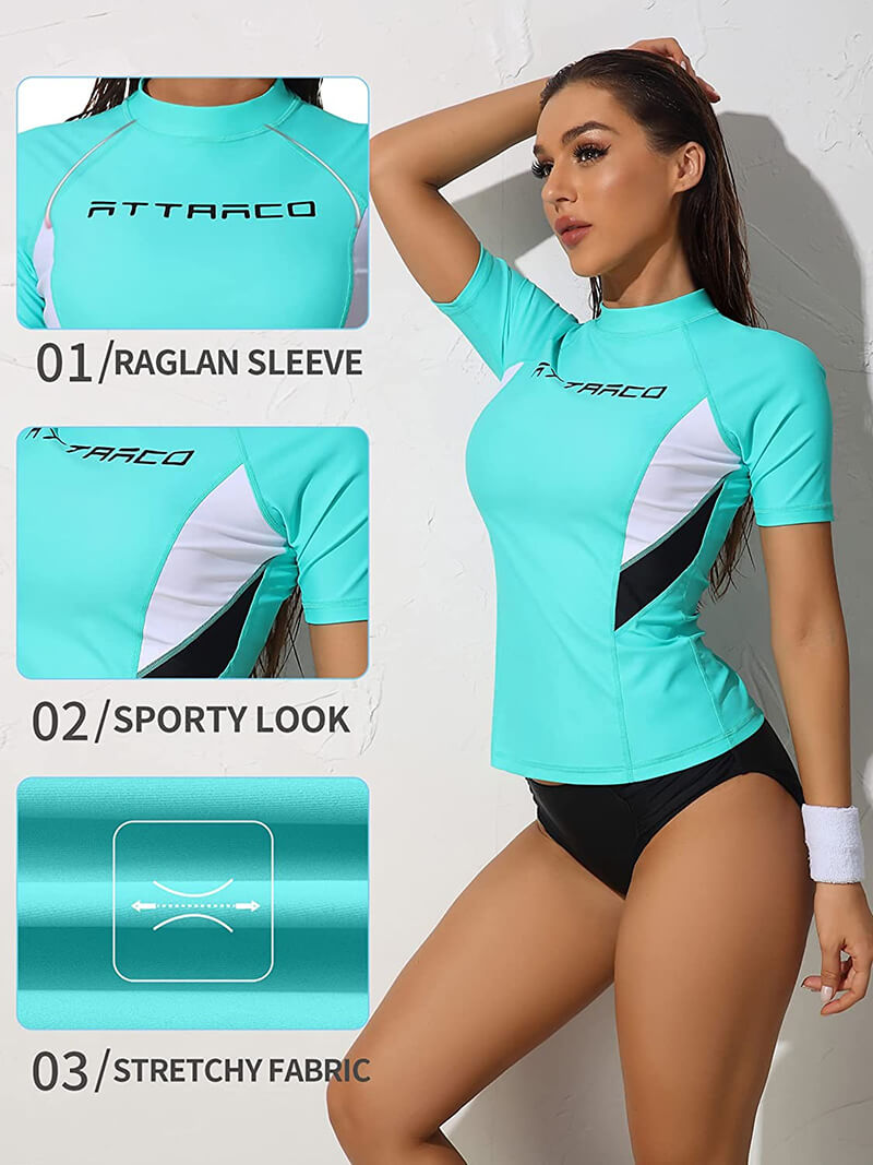 Women's teal rashguard swimwear with raglan sleeves, sporty look, and stretchy fabric